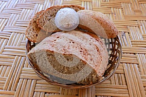 Fresh homemade bread made of wheat and rye flour. Sliced bread in a wicker basket. Fresh homemade bread made of wheat and rye flou