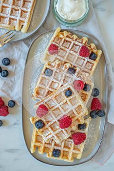 Fresh homemade brussels waffles with berries