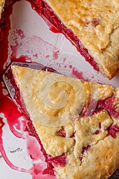 Fresh homemade cherry pie on a white background. Juicy piece of cherry pie.