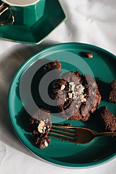 Fresh homemade chocolate chip cookies on green plate. Sweet breakfast. Stack of traditional chip cookies with chocolate chunks.