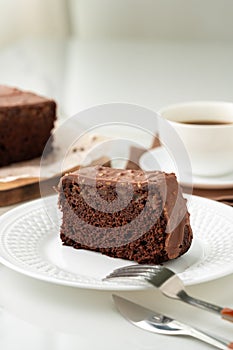 Fresh homemade chocolate sponge cake on wooden board