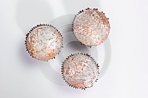 Fresh homemade delicious muffins with sugar powder