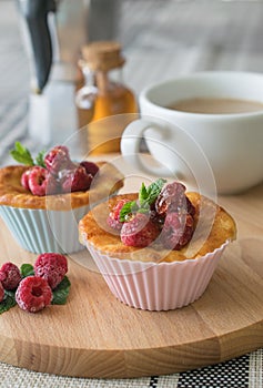 Fresh homemade delicious raspberry muffins with coffee for breakfast