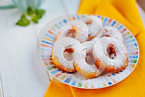 Fresh homemade donuts with icing sugar