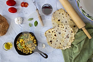 Fresh homemade flatbread with garlic, oil and other meditteranean foods