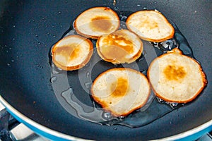 Fresh homemade pancakes flapjacks cooking on the hot pan