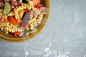 Fresh homemade pasta salad with tomatoes, olive and pepper