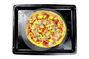 Fresh homemade pizza with sausage, cheese and pickles topview on a baking sheet