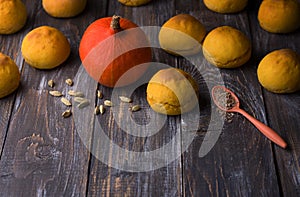 Fresh homemade pumpkin buns yeast-free with cardamom on wooden background