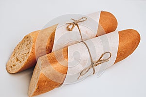 Fresh Homemade Sliced French Baguette Bread isolated on white background