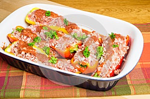 Fresh stuffed peppers in pan ready to bake