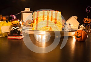 Fresh homemade sweet food dessert Strawberry Crepe Cake with festive Halloween theme decoration background. Sweets, treats, snack,