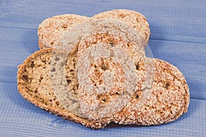 Fresh homemade wholegrain bread in shape of heart for breakfast