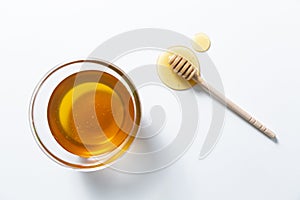 Fresh honey bee in bowl on white background. top view