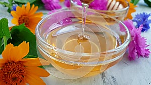 Fresh honey flower calendula nutrition dessert liquid organic on concrete background