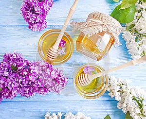 Fresh honey natural healthy  spring heather lilac flower compositionon wooden background