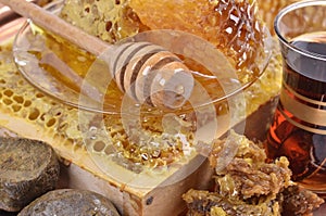 Fresh honeycombs and wooden stick ,cup of Turkish tea