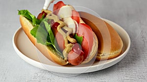 Fresh hot dog buns on wooden table