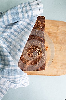 Fresh hot homemade bread from rye flour on a kitchen towel