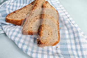 Fresh hot homemade bread from rye flour on a kitchen towel