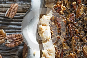 Fresh hot pecan pie served on a rustic table top
