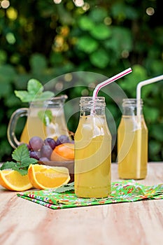 Fresh iced drinks with grapes and orange