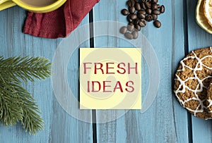 Fresh Ideas text on paper on wooden