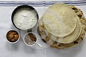 Fresh Indian flat breads Naans and poppadums photo