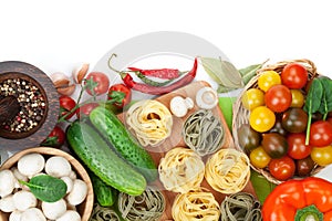 Fresh ingredients for cooking: pasta, tomato, cucumber, mushroom