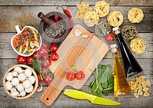 Fresh ingredients for cooking: pasta, tomato, mushroom and spice