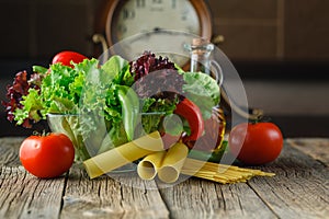 Fresh ingredients for cooking: pasta, tomato and spices