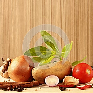 Fresh ingredients for cooking are on wooden background