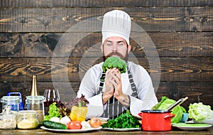 Fresh ingredients only. Culinary recipe concept. Man bearded hipster cooking fresh vegetables. Freshest possible