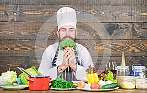 Fresh ingredients only. Culinary recipe concept. Man bearded hipster cooking fresh vegetables. Freshest possible