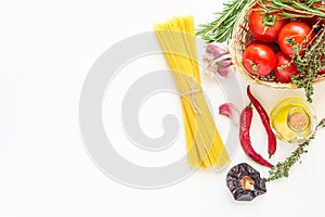 Fresh Italian Pasta Dish Ingredients. Ripe Red Tomatoes Rosemary Thyme in Wicker Basket Olive Oil in Bottle Spaghetti Hot Peppers