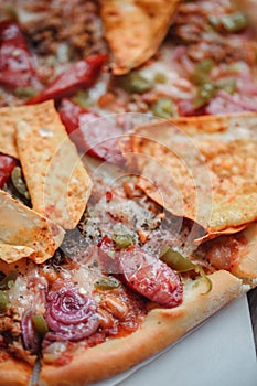 Fresh italian pizza. Food photography for design. Mexican pizza with chips, onion, hot jalapeno pepper on thin classic