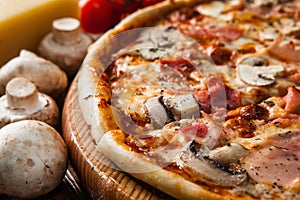 Fresh italian pizza served on wood table close up