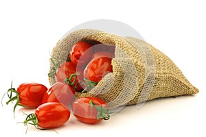 Fresh italian pomodori tomatoes in a burlap bag