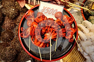 Fresh japanese octopus on the plate as street food in Osaka