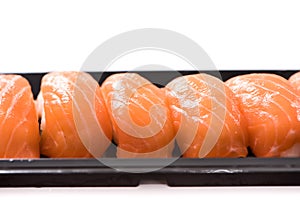 Fresh japanese salmon sushi in plate on white background