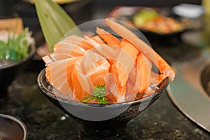 Fresh Japanese Sashimi set in Asian restaurant, orange Salmon and tuna sashimi fish on dish with ice. Japan food concept
