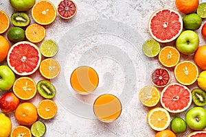 Fresh juice vitamin c drink in citrus fruits background flat lay, helthy vegetarian organic antioxidant detox