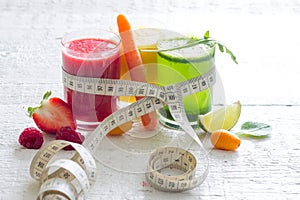 Fresh juices measuring tape fruits and vegetables lose weight diet concept