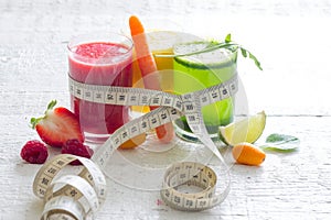 Fresh juices measuring tape fruits and vegetables lose weight diet concept photo