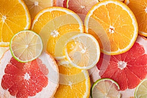 Fresh juicy citrus fruit background, top view