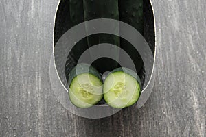 Fresh and juicy green cucumbers ready to cut in the kitchen and eat in salad
