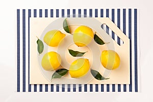 Fresh, juicy lemon on a kitchen cutting board made of artificial stone