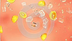 Fresh juicy orange and juice, ice cube and water drops splash pours in super slow motion 1000 fps. Citrus orange slices