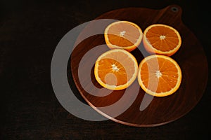 Fresh juicy oranges on brawn background