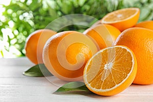 Fresh juicy oranges with leaves